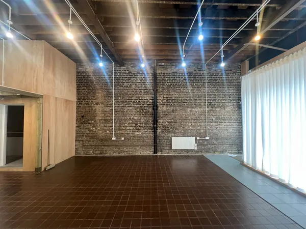 Shop unit stripped out to its brick walls and ceiling joists before the fit-out